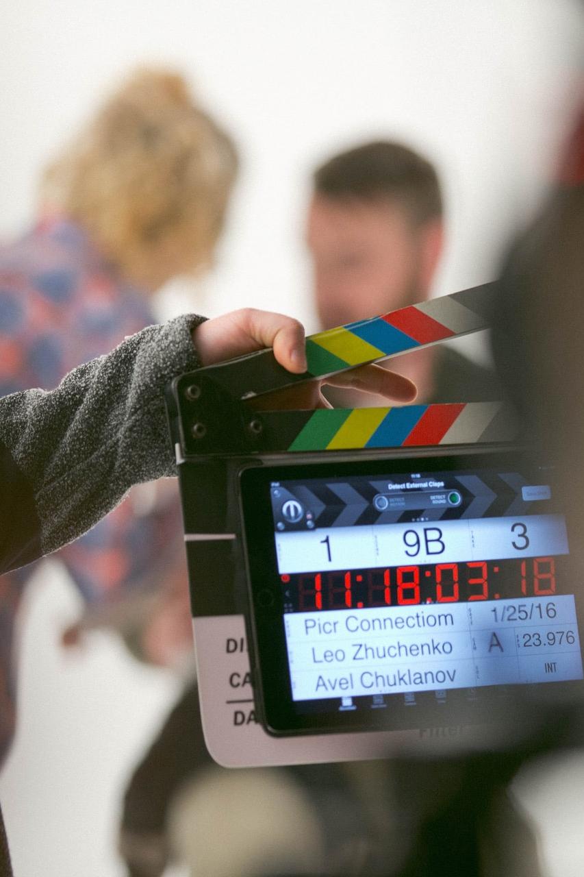 person holding clapperboard